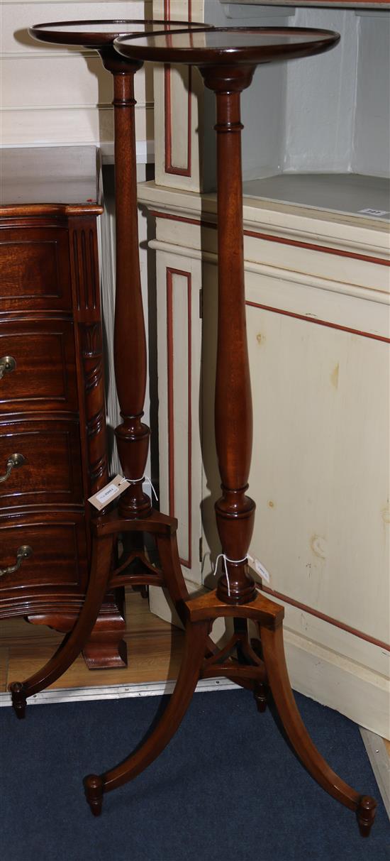 A pair of faded mahogany torcheres H.115cm